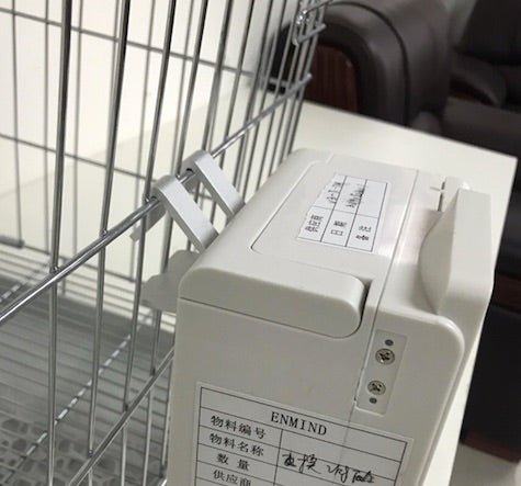 Cage mounting bracket on the Enmind V5 infusion pump