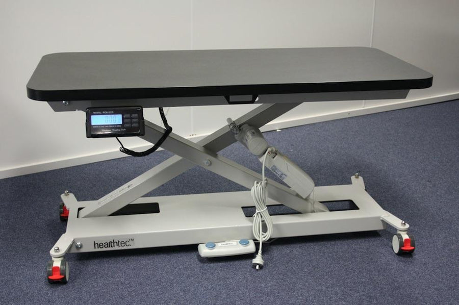 Vet Table with integrated weight scales for measuring animal weights without lifting them from the table